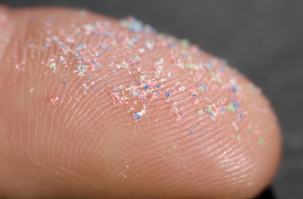 Picture of micro plastic powder on a finger tip