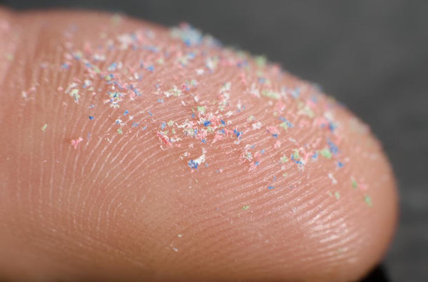Picture of micro plastic powder on a finger tip