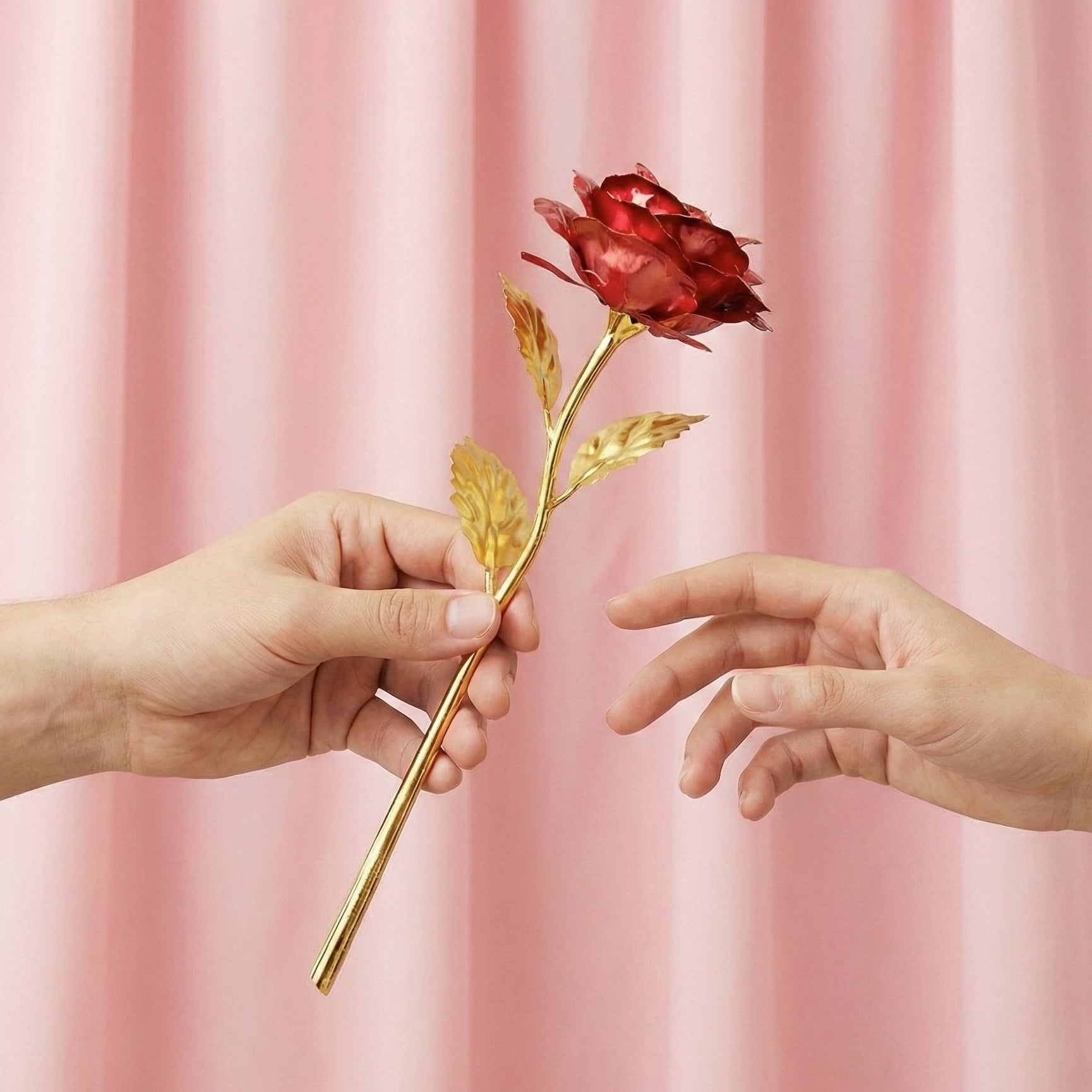 Full view of a 24K artificial golden rose with red petals, detailed stem and leaves.