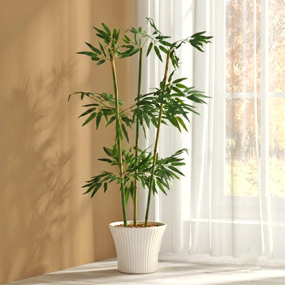A studio shot against a solid white background showing four realistic artificial bamboo stalks featuring detailed dark green, lance-shaped leaves.