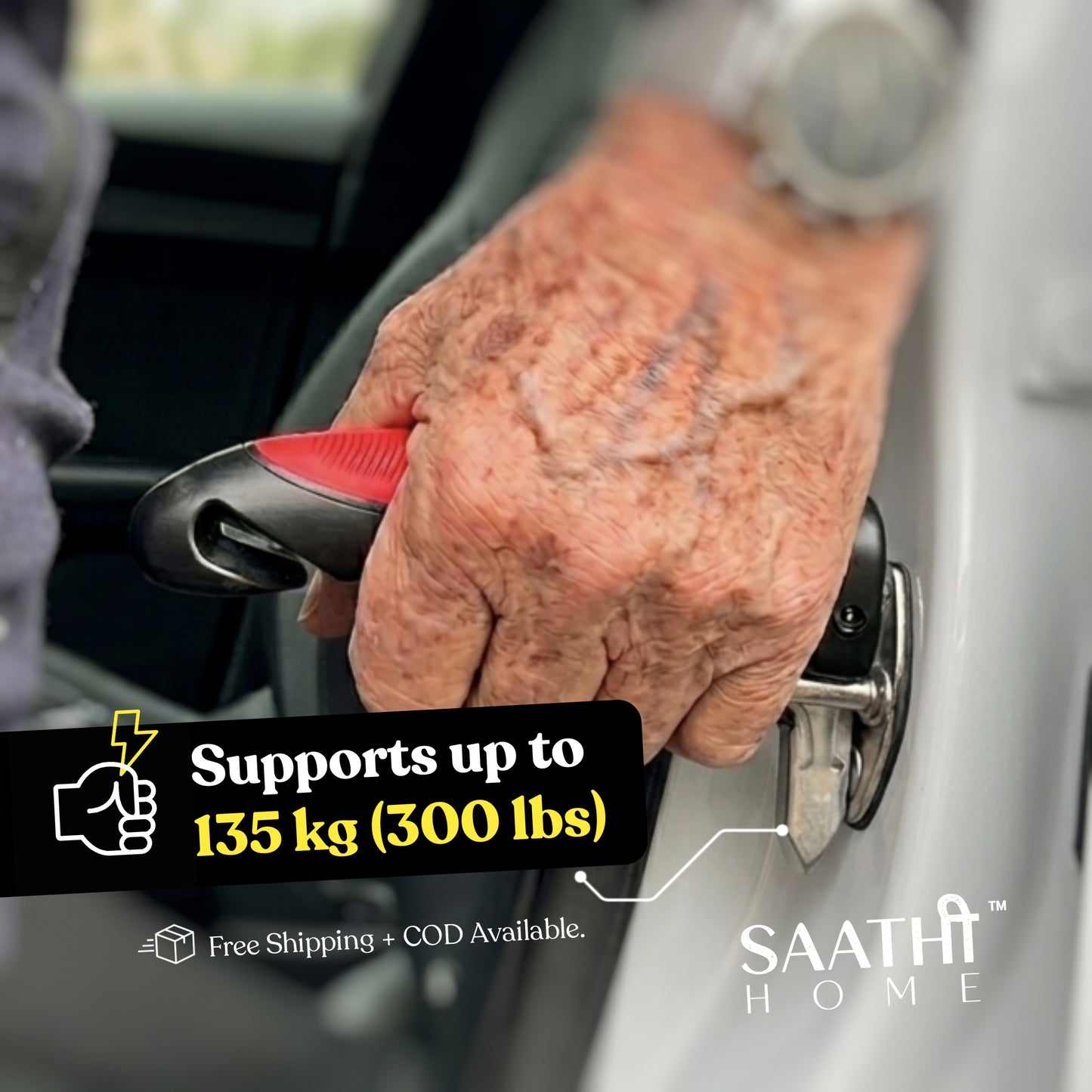 An elderly person's hand gripping the Saathi Home car door handle inserted into a car latch, highlighting it supports up to 135 kg (300 lbs).