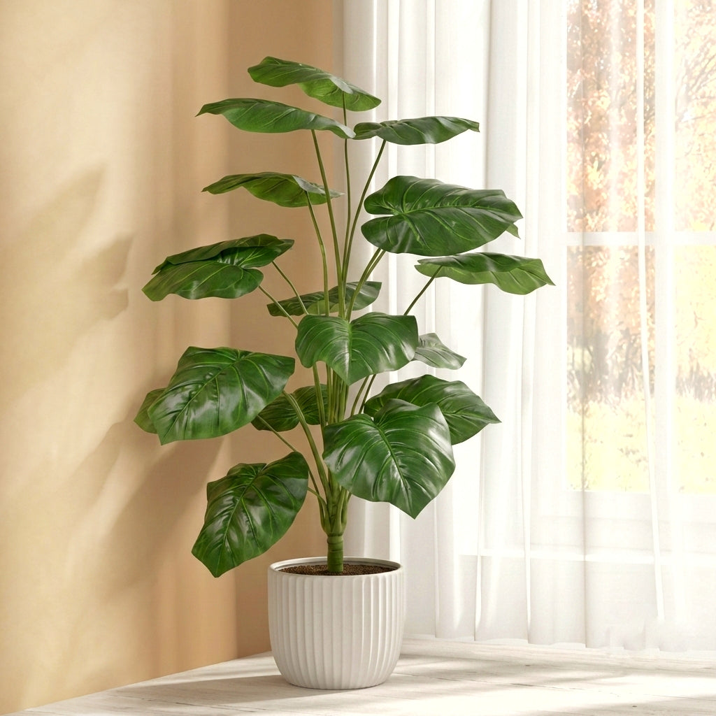 A realistic 95cm artificial Monstera plant featuring 18 lush, vibrant green leaves, standing on a bright floor next to a sheer-curtained window.
