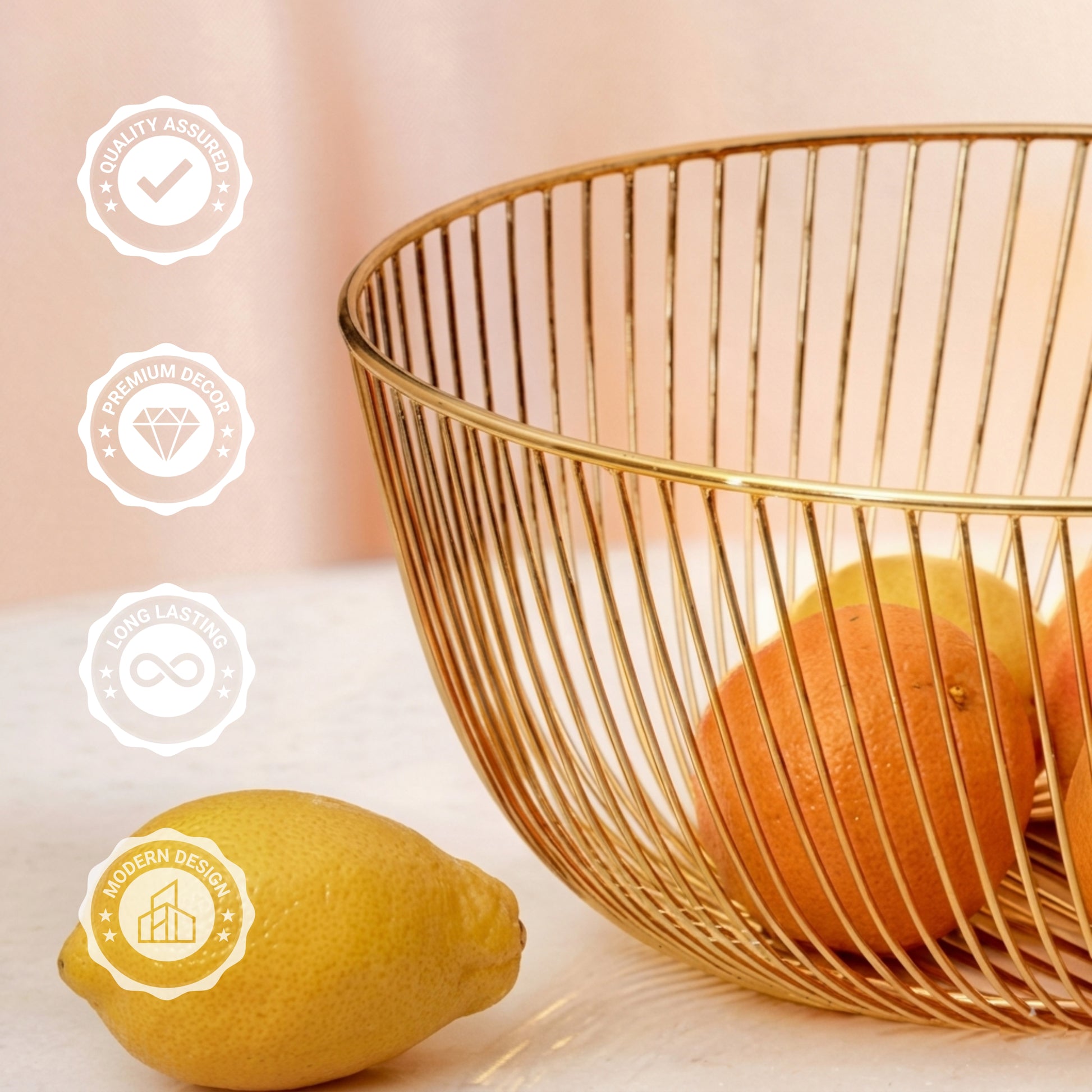 Sleek 10x10 inch gold metal wire basket on a solid white surface, styled as a modern minimalist fruit bowl containing oranges