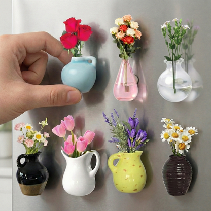 Mini flower pot magnets holding photos on a kitchen fridge