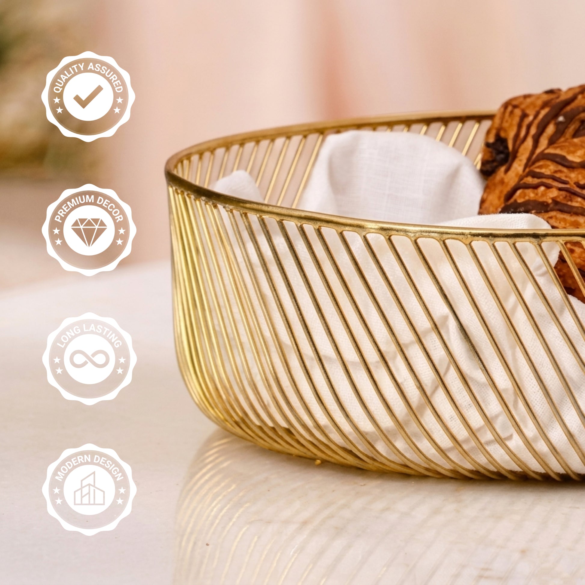 Elegant gold metal bread basket used as a table centerpiece, featuring a slanted wire design, placed on a marble table with star anise and coffee beans.