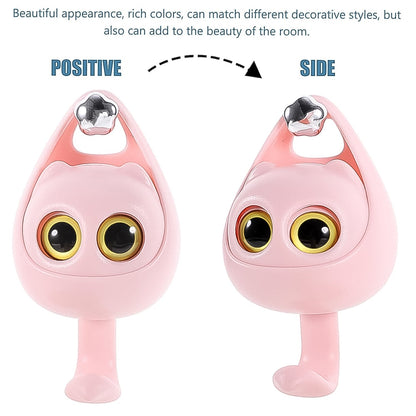 Front and side profile angles of the pink cat wall hook, highlighting its protruding big eyes, silver crown accent, and curved tail hook.