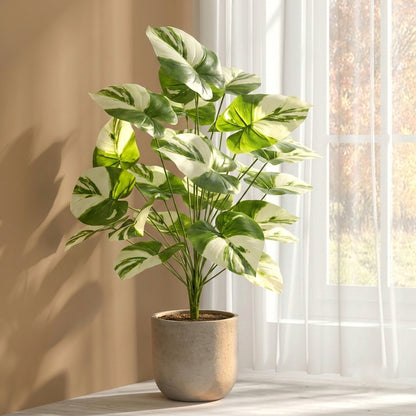 High-resolution 8k professional photograph of a 70cm artificial indoor plant featuring 24 vibrant green and white variegated leaves 